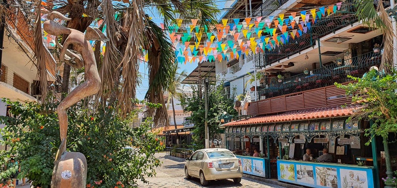 Papel Picado hangs over the street in the Romantic Zone Puerto Vallarta For Sale