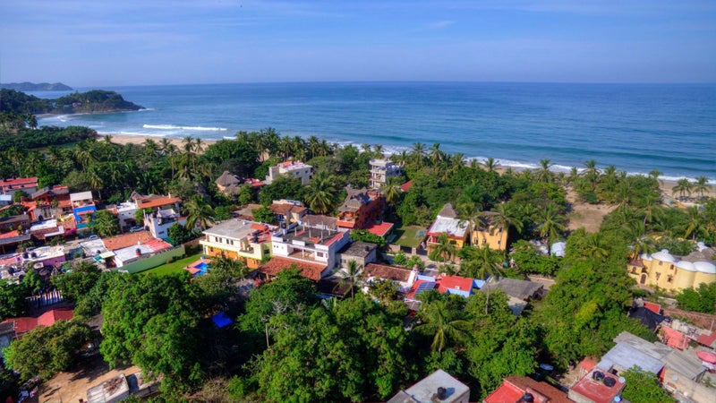 Aerial view of the ocean and San Pancho homes for sale