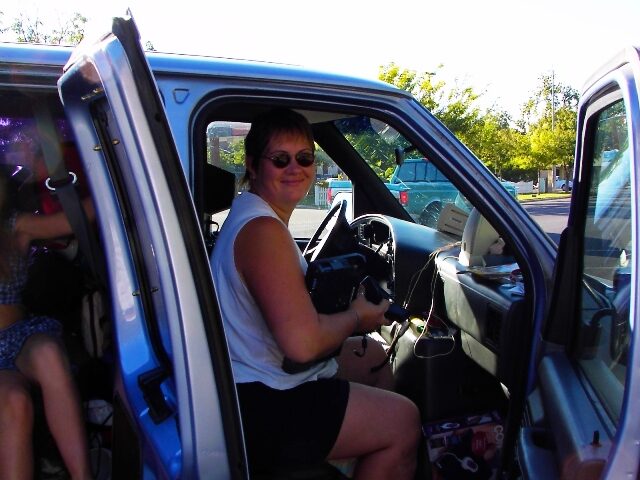 Christie Forget at the wheel of the family's 15-passenger van, packed and ready to drive to Mexico